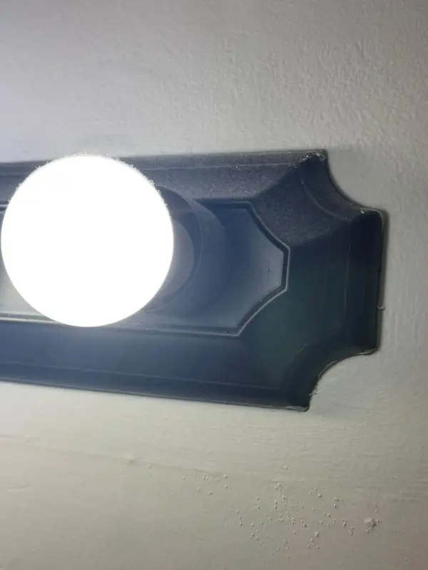 Vanity light before, with the dirt